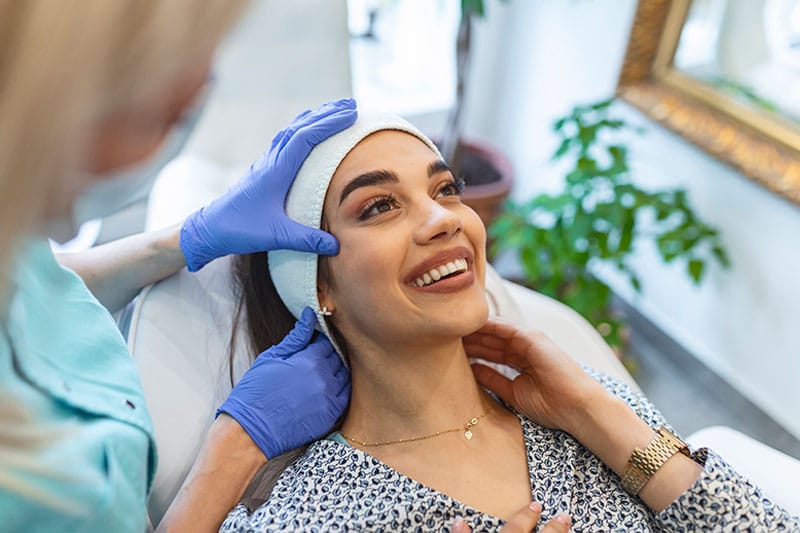 woman receiving facial balancing in Boston, MA