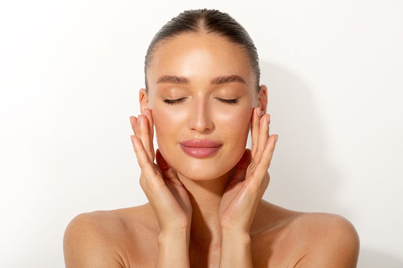 woman smiling after getting sculptra in Boston, MA
