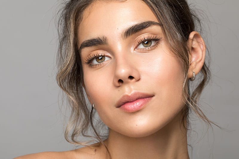 woman after getting upper eyelid surgery in Boston, MA